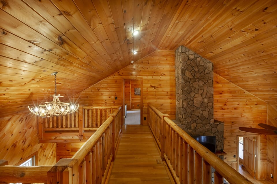 Upstairs Hallway Connects Two King Suites While Overlooking Living Area