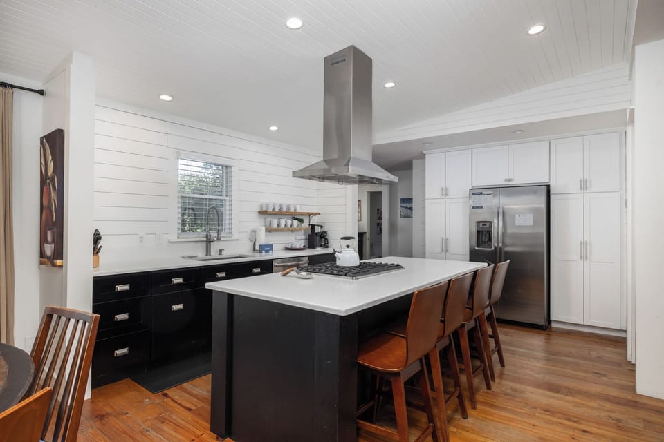 Your updated kitchen features a large center island with bar top seating