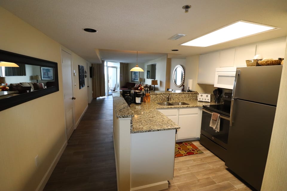 Kitchen area with granite counters and new appliances