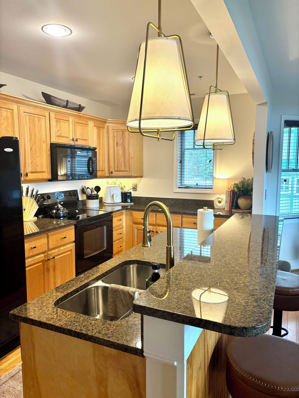 Fully equipped kitchen with everything you need, plus bar seating for easy meals.