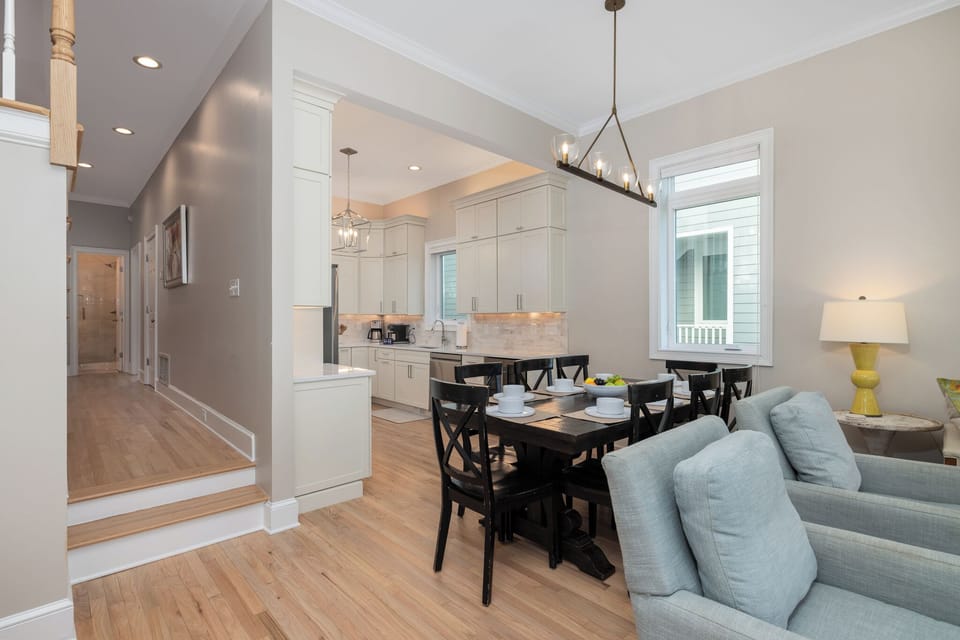 The open-concept living space flows seamlessly between kitchen, dining, and living areas