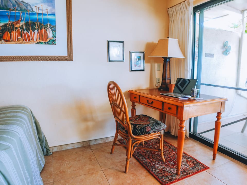 Desk by sliding glass door looking out at the ocean. High speed internet.