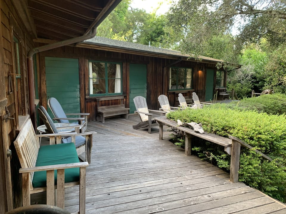 Enjoy relaxing on the large deck, which overlooks the expansive, private garden.