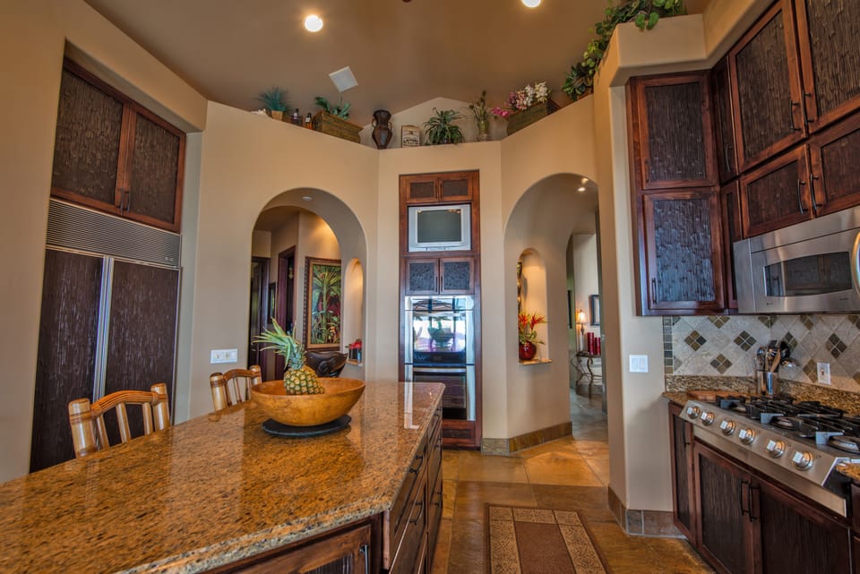 Large granite island for eating and entertaining with views of ocean&pool/spa