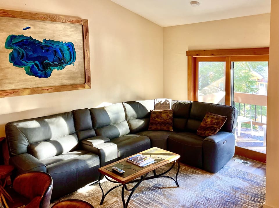 Large sectional and deck with a view of the village