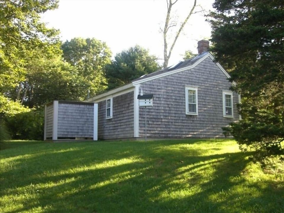 Back of separate guest quarters and outdoor shower