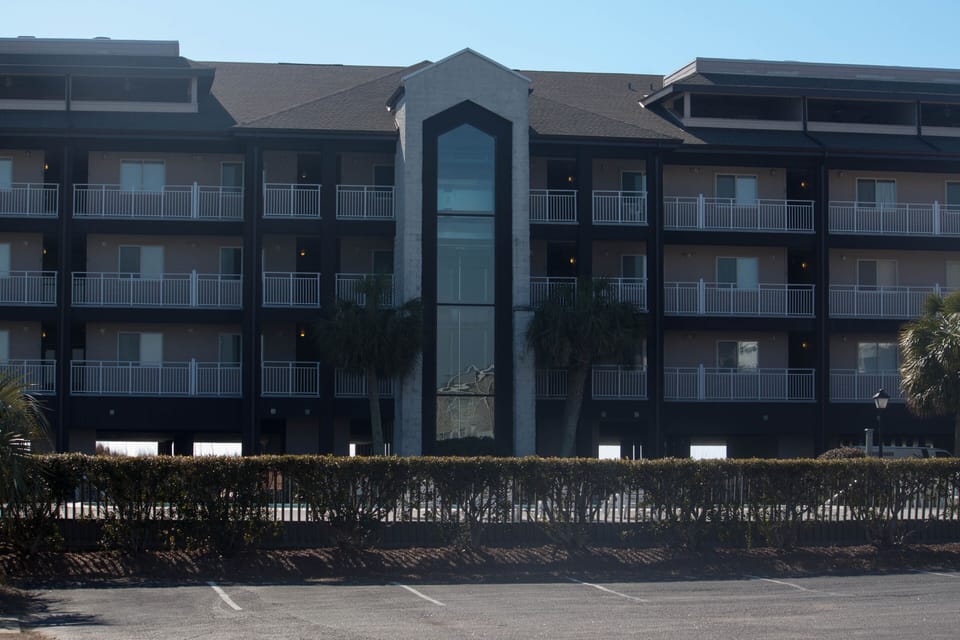 Windjammer front with elevator in center and parking underneath.