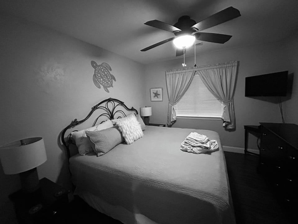 King bed bedroom at rear of the condo
