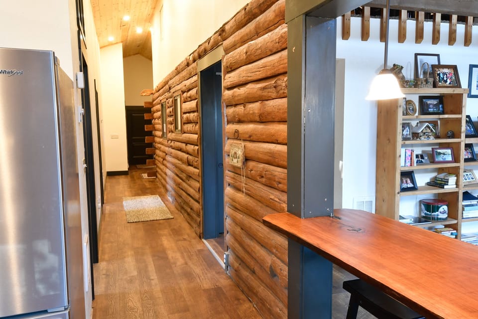 Long hall to the entryway.  Bar area for more seating in the kitchen/dining room