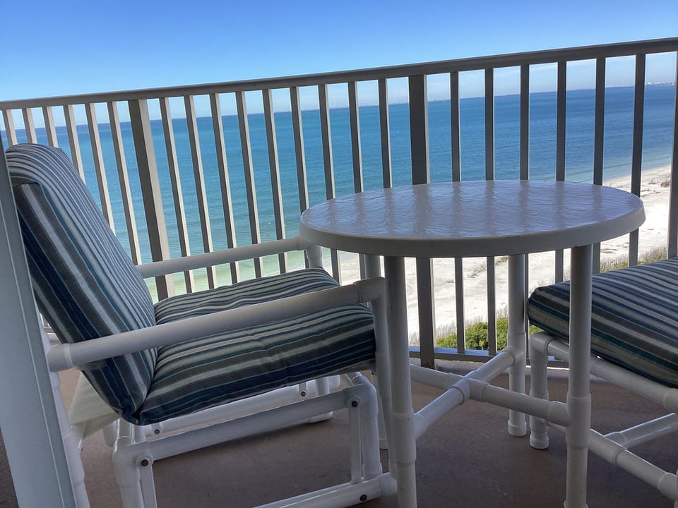 Direct gulf view from balcony, with new glider chairs