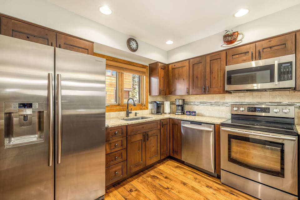 Well-stocked kitchen with Keurig & regular drip coffee makers and spices.