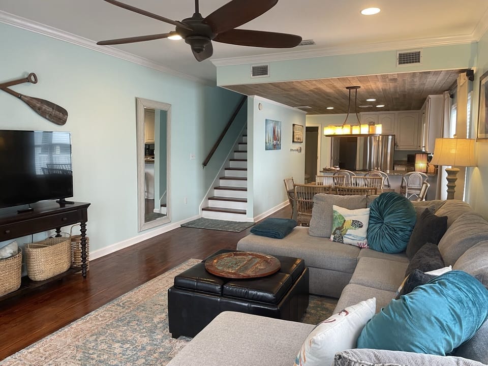 Living Room with kitchen in the background.
