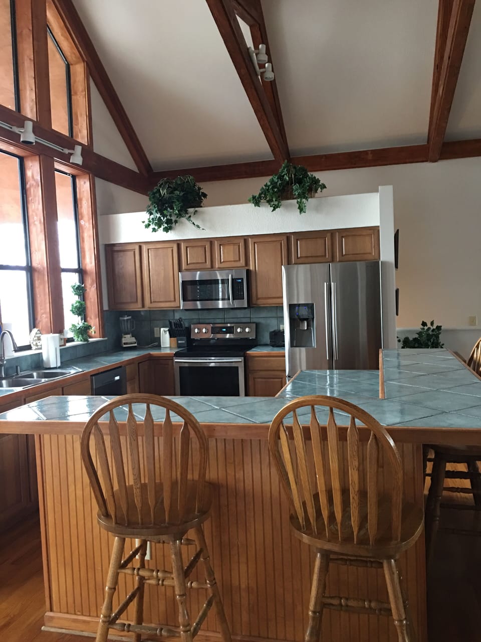 Fully equipped kitchen with new stainless steel appliances and walk-in pantry