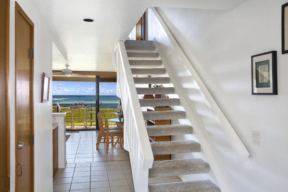 Entrance area of our condo with closet containing items for the beach.