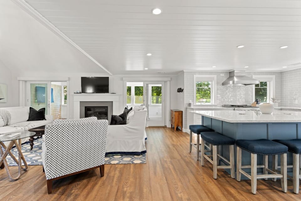 Inside you'll find an open concept with chef inspired kitchen, living area, wet bar and dining room.