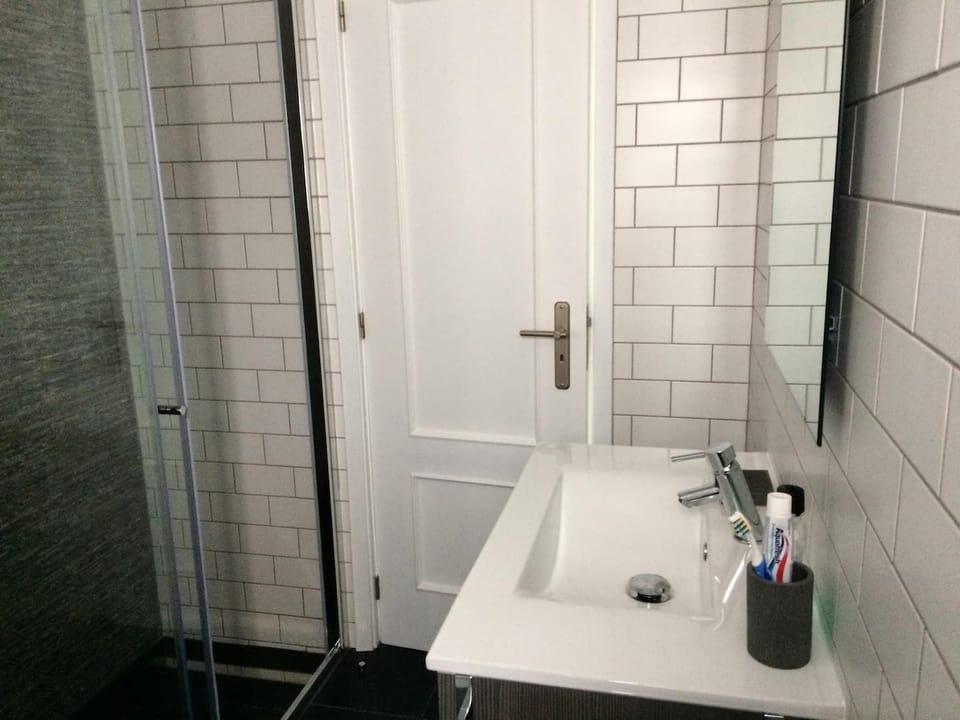 Contemporary interior designed walk-in shower.