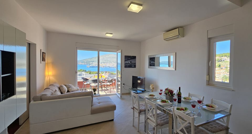 Open plan dining/living area with sea view