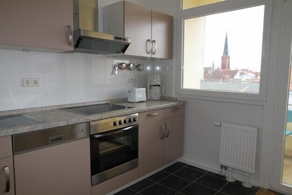 Kitchen with a view over the roofs to the south