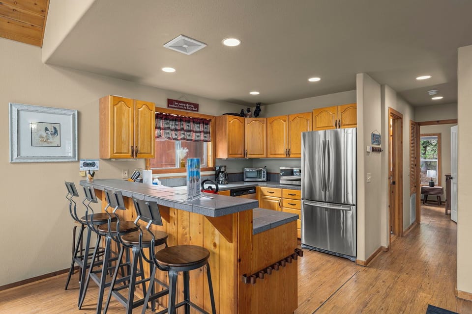 Gather around this spacious kitchen island where your group can cook together and share stories over morning coffee or evening wine.