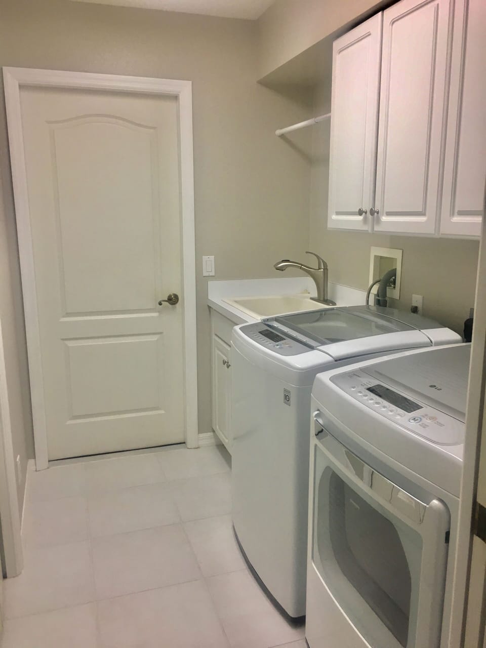 Laundry room with updated washer and dryer. 