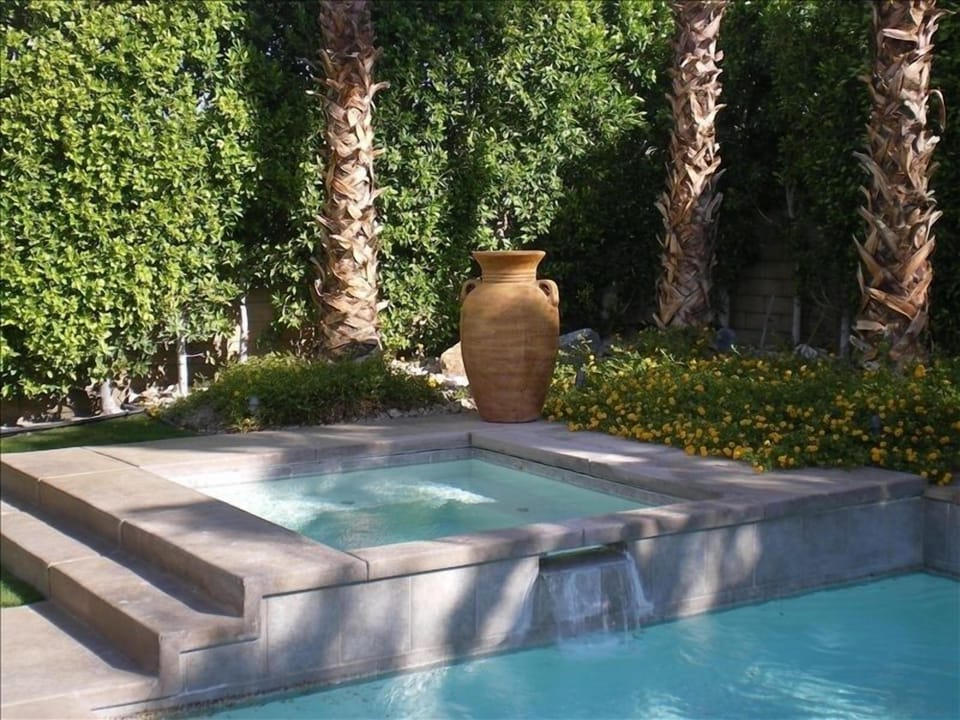 The backyard spa accomodates six comfortably and has a partial mountain view.