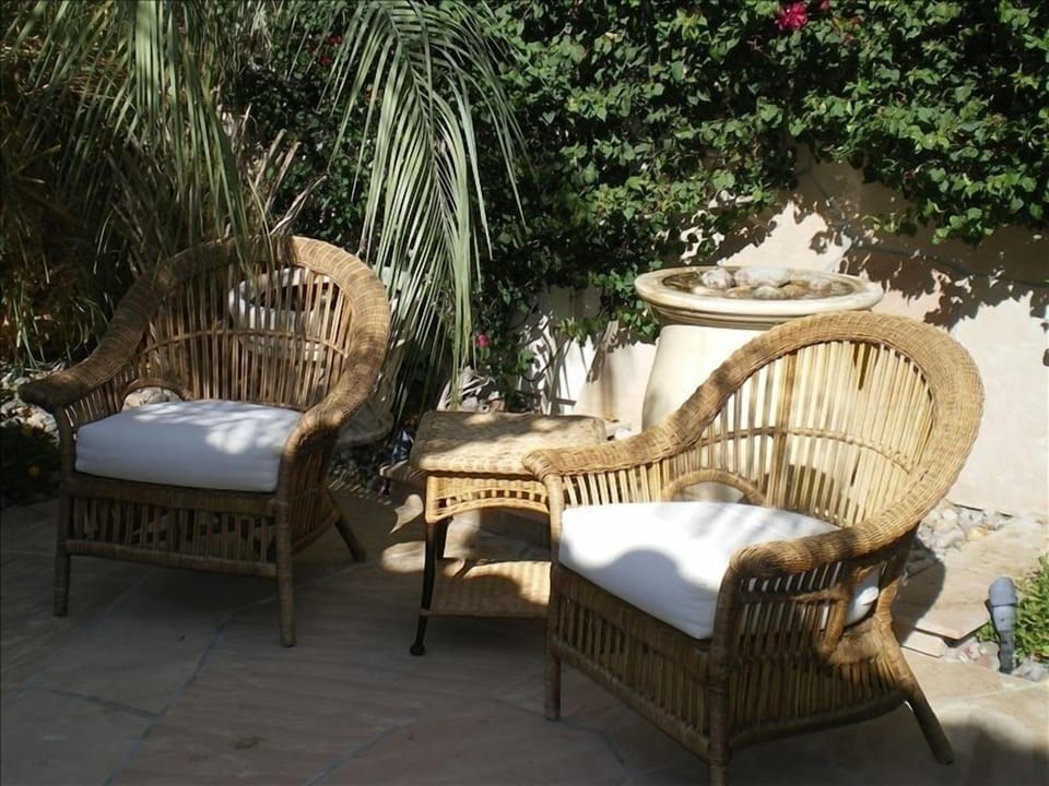 Enjoy sitting in the courtyard alongside a lovely overflowing urn water feature.