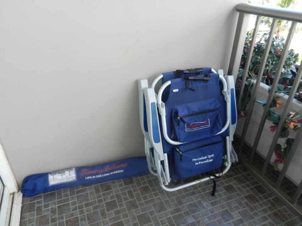 Tommy Bahama sand chairs and umbrella for our guests' beach use, and a cooler.