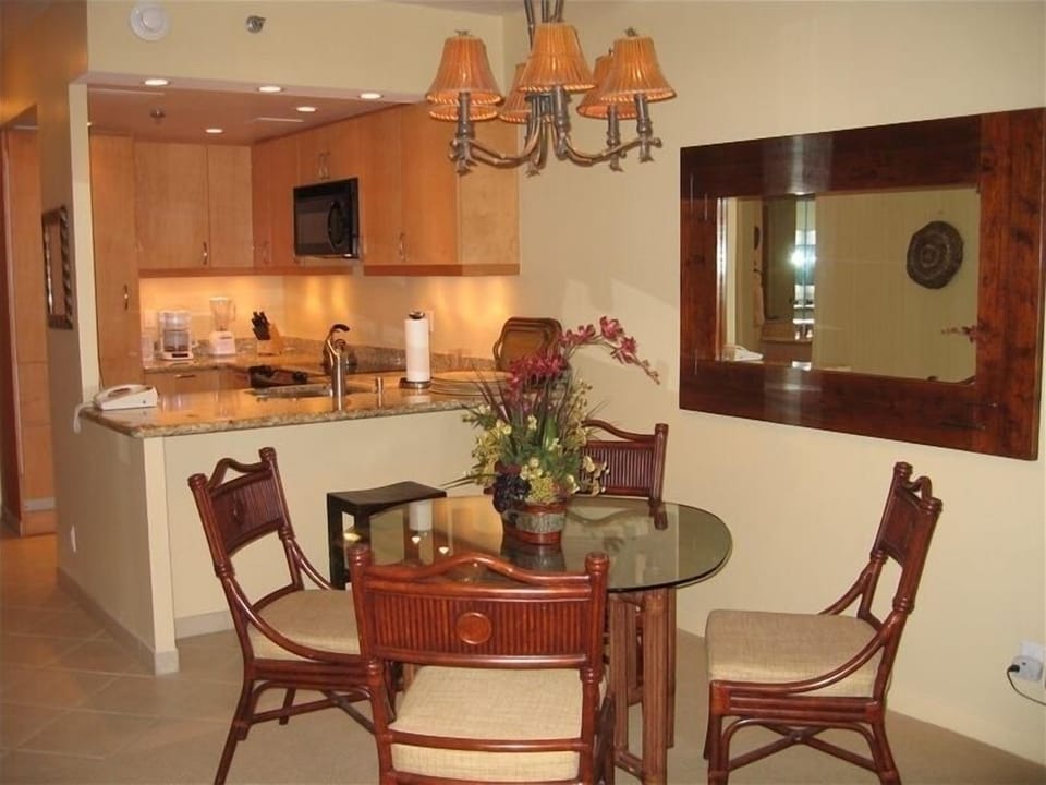 Dining Area seats four with deep bar/serving counter.