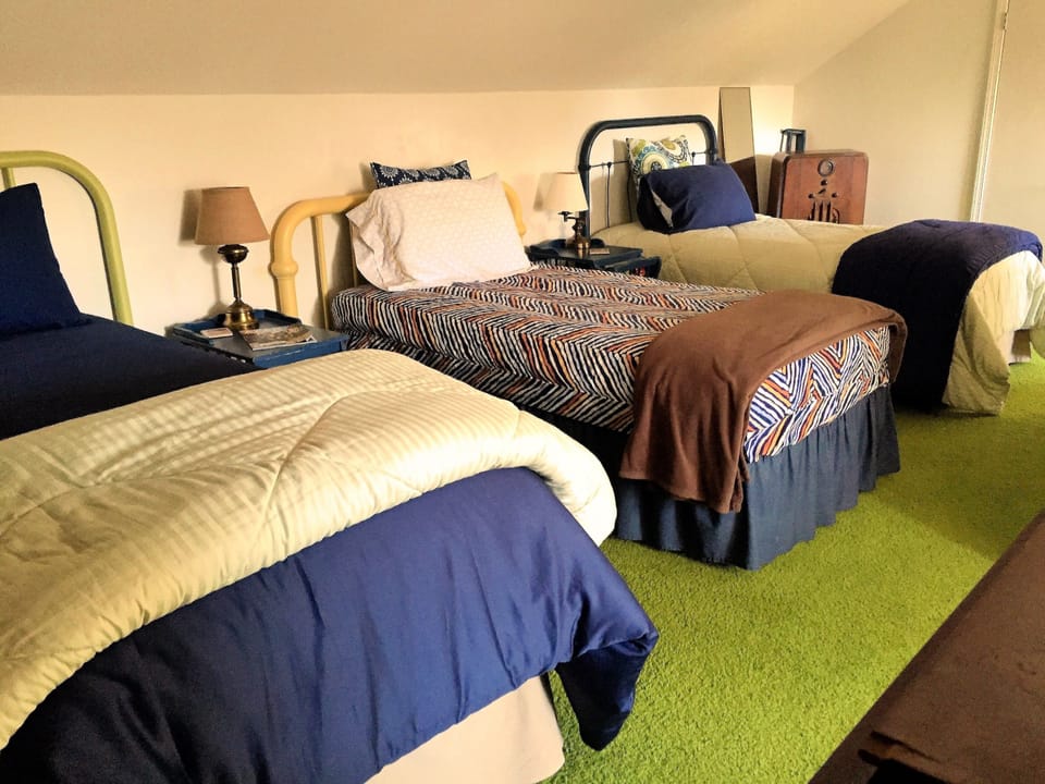 Maps - three twin beds - one has an extra-long mattress