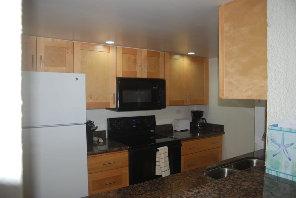 New kitchen with granite counters and new appliances
