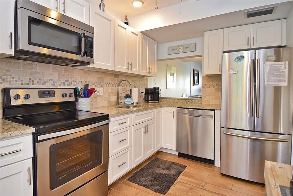 well stocked kitchen with updated appliances