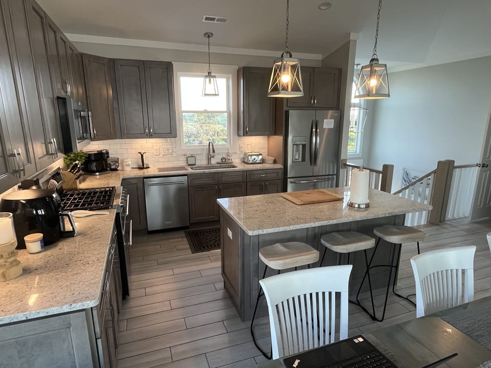 Large kitchen for multiple cooks. Note the gallery of small appliances available