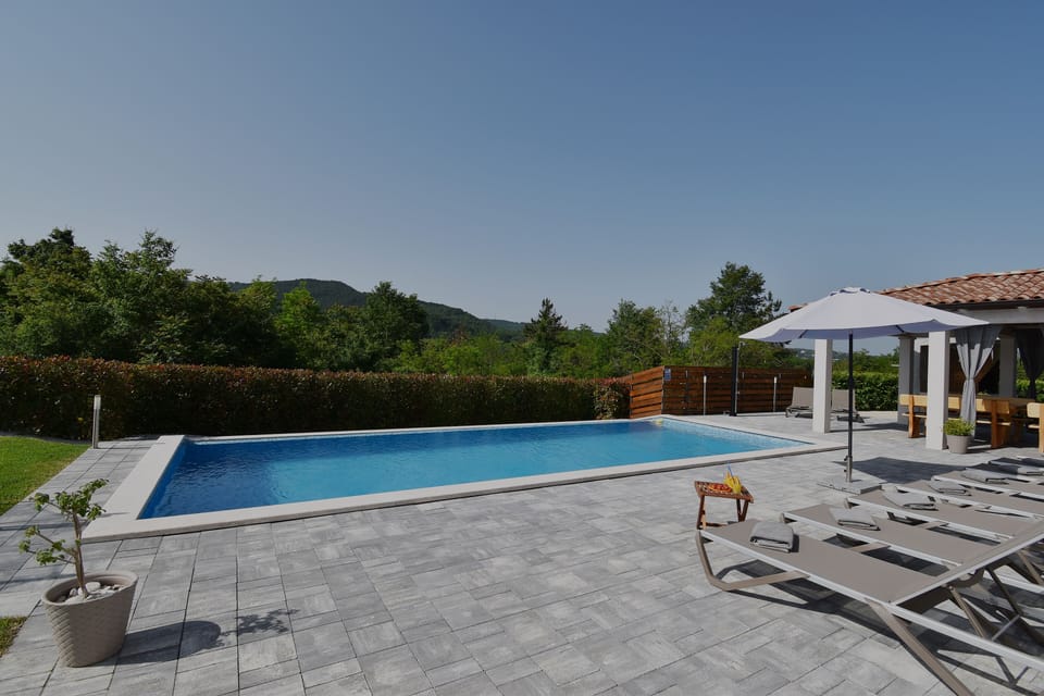 Large pool with a beautiful view to the nature around 