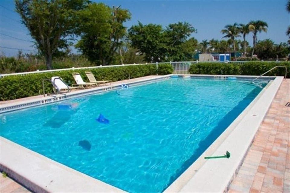 one of the 3 heated pools with chairs provided at the pool. 