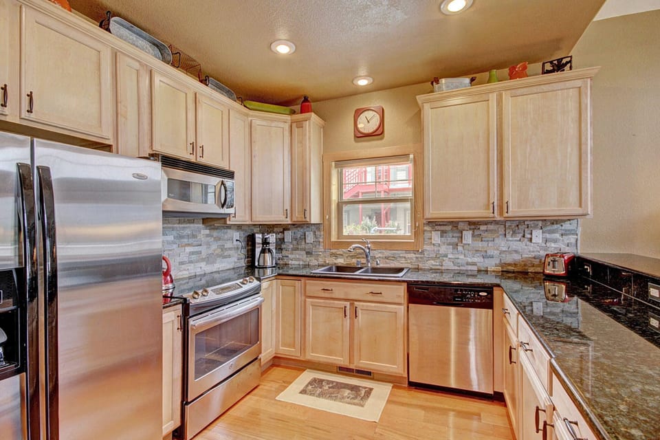 Bright & Spacious Kitchen w/ Granite, Stainless and all the necessary cookery.