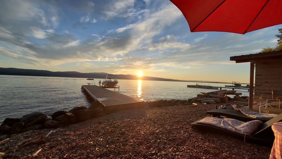 Watching the sun go down over the dock from our beach