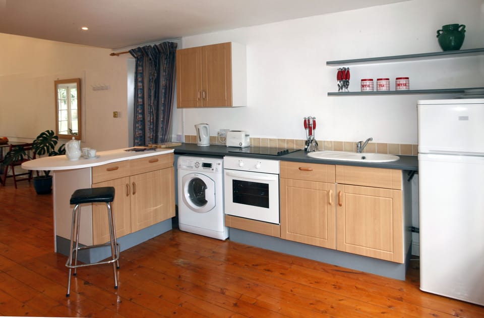 Washer/Dryer, Sink unit ,  Fridge  and cooker . Plates Utensils etc