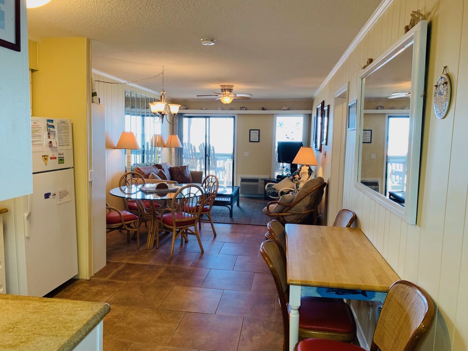 Open and airy kitchen, dining area and living room with an awesome beach view