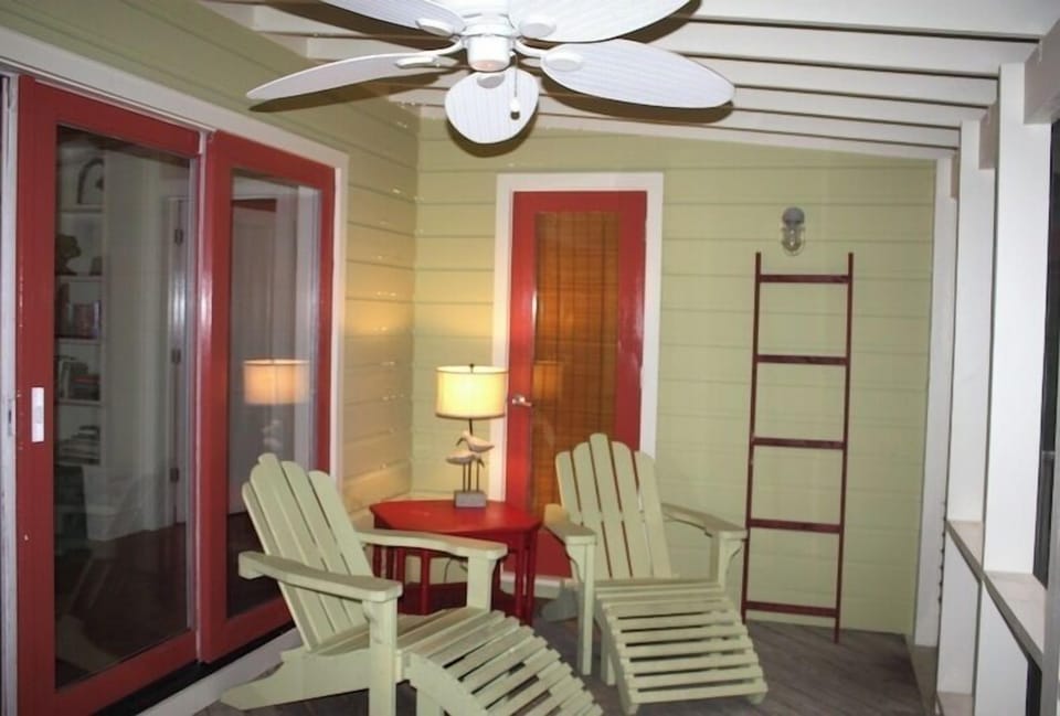 Make time to relax on screened in porch - overlooks the pool