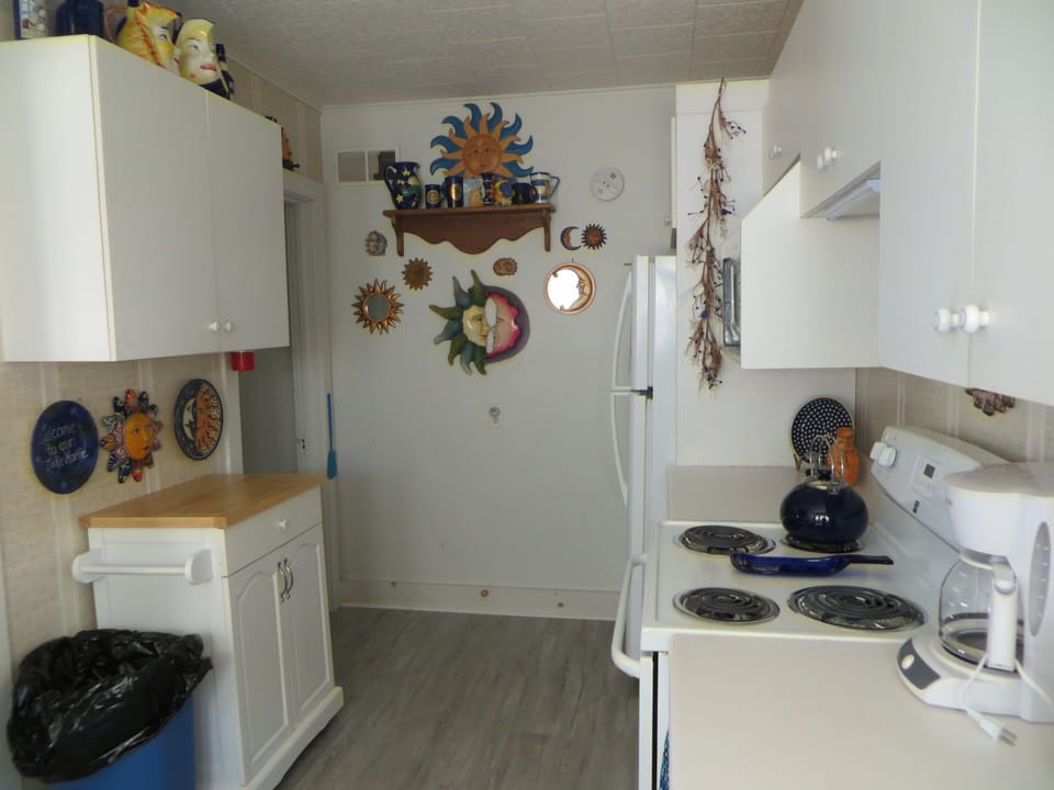 Kitchen  ( bottom floor bedroom across from refrigerator)