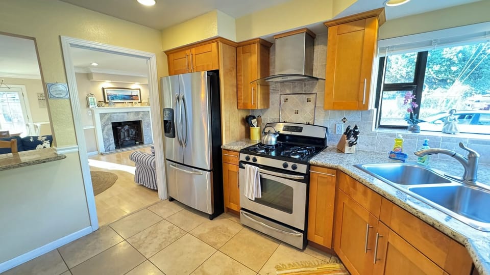 Well appointed kitchen with granite counters and stainless steel appliances