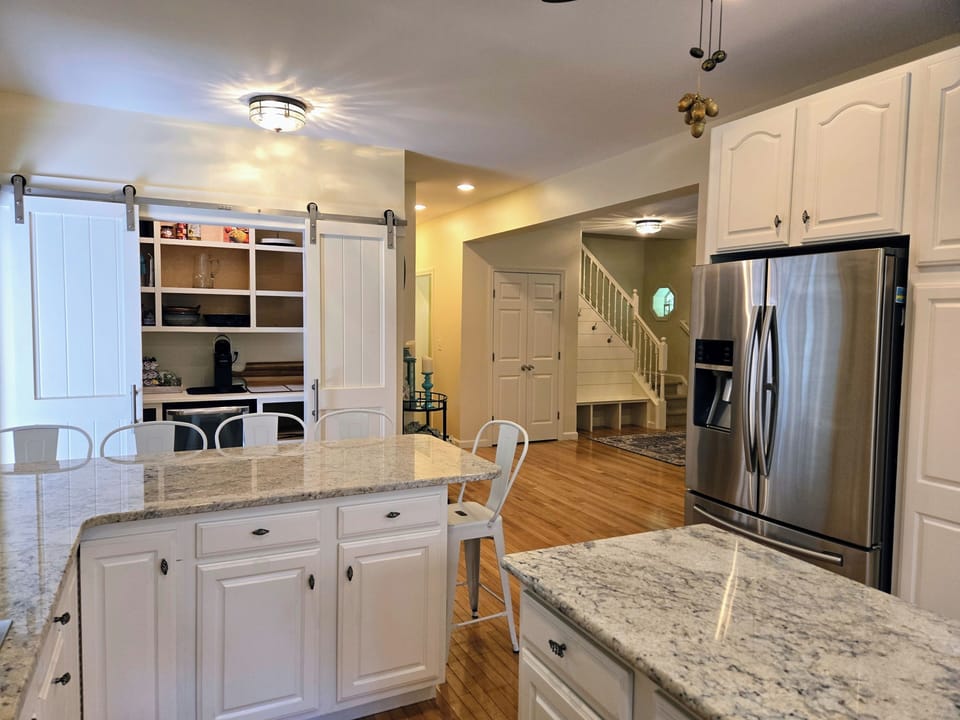 View from kitchen to new (2024) expansive panty and living area