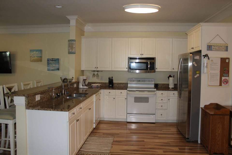 Kitchen is well equipped including small appliances