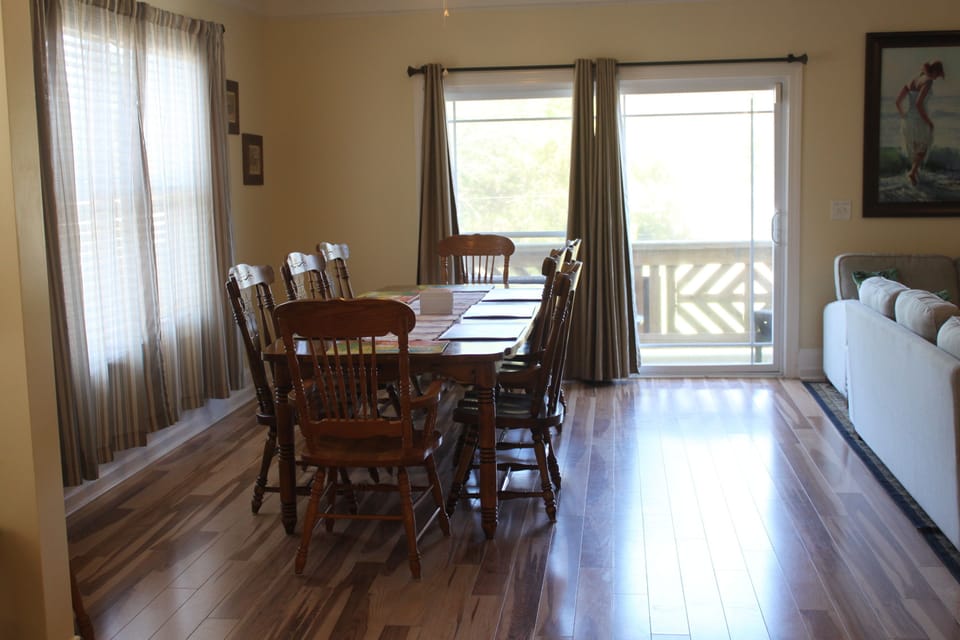 Dining area with covered deck at front of house