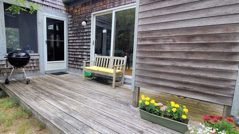 Small deck with outdoor shower off screen porch