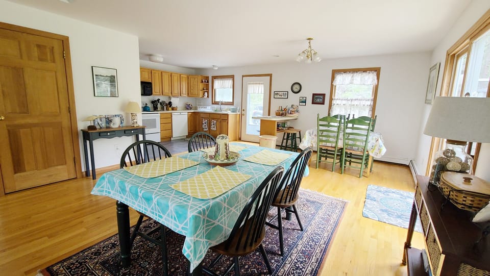 Dining area with kitchen beyond