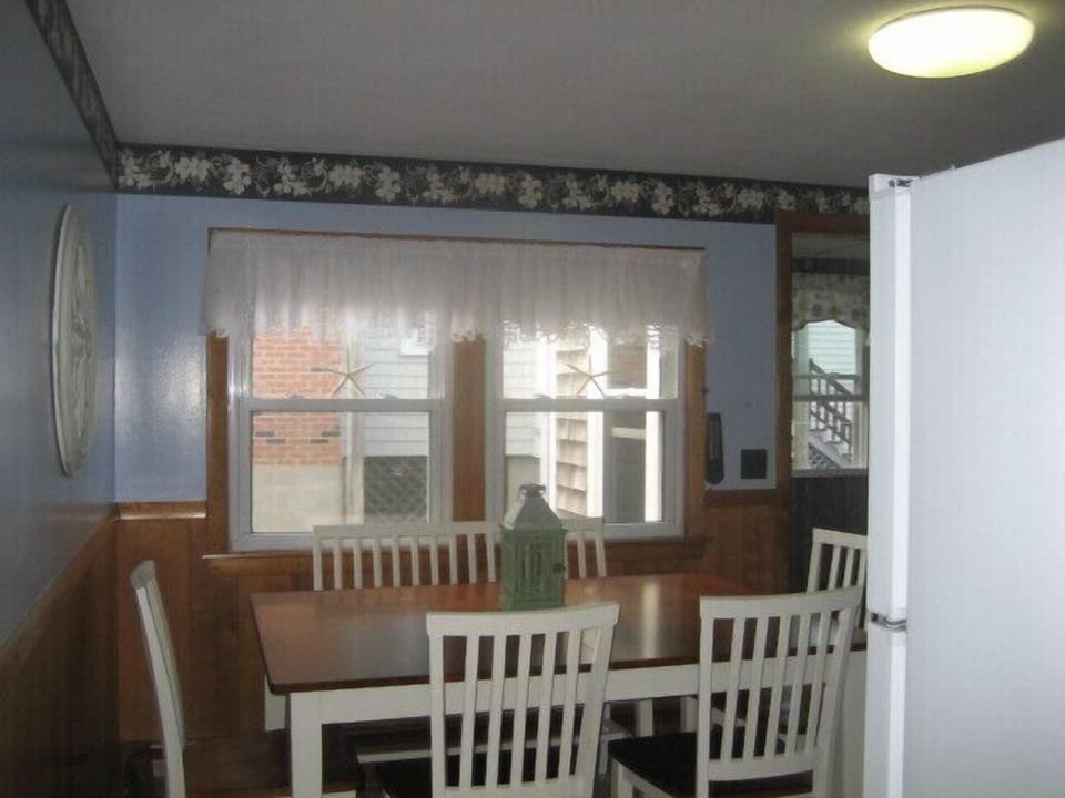 The dining area expands with an extra leaf for the table.