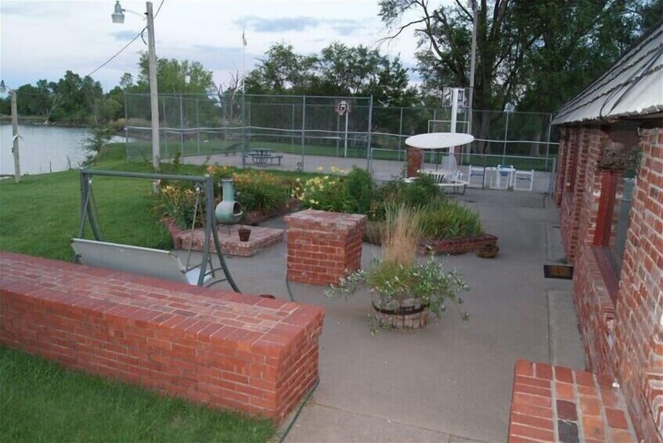 Front patio & tennis/basketball court.