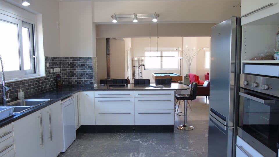 spacious kitchen that leads to the open living area