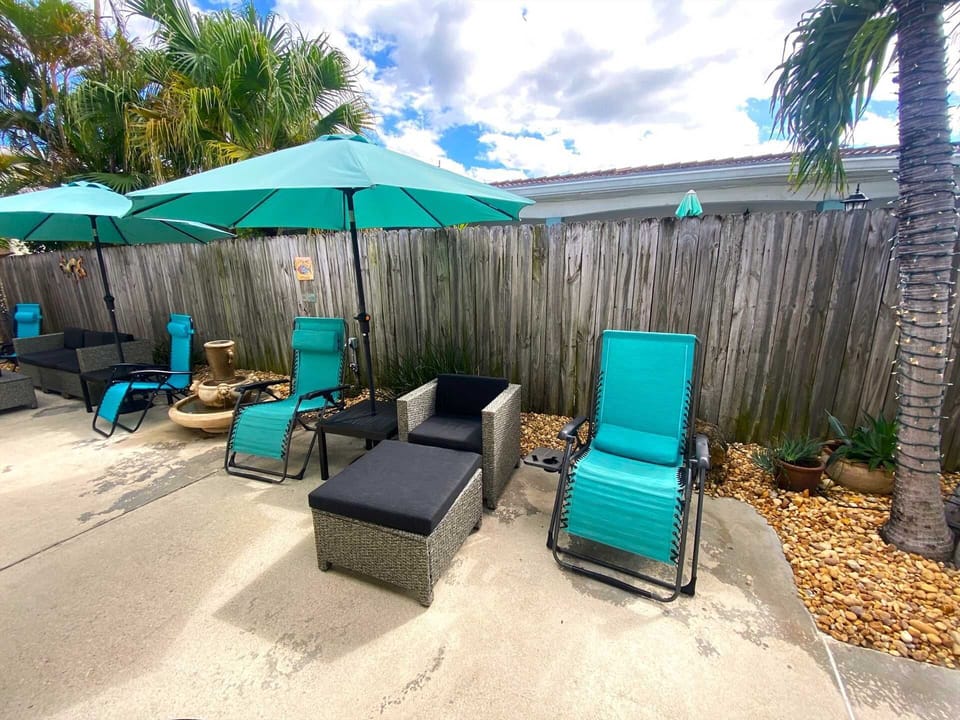 Relax in the courtyard on one of the chaise lounges under a sunbrella.